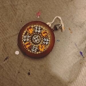 This is an antique compact mirror
